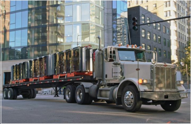 large delivery truck driving in city