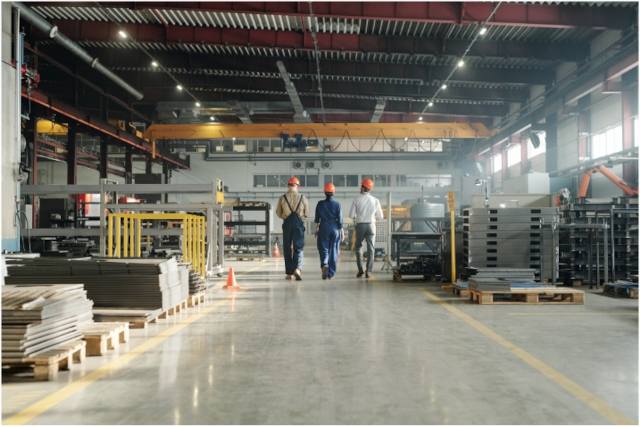 men walking in large warehouse